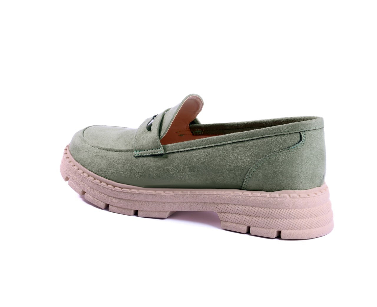 A pair of sage green suede chunky loafers