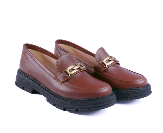 A pair of Havana chunky loafers with a thick black lug sole and gold chain