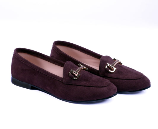 Pair of brown loafers with gold buckles on a white background