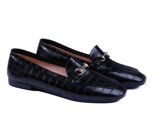 Black crocodile-patterned loafers with gold buckles on a white background