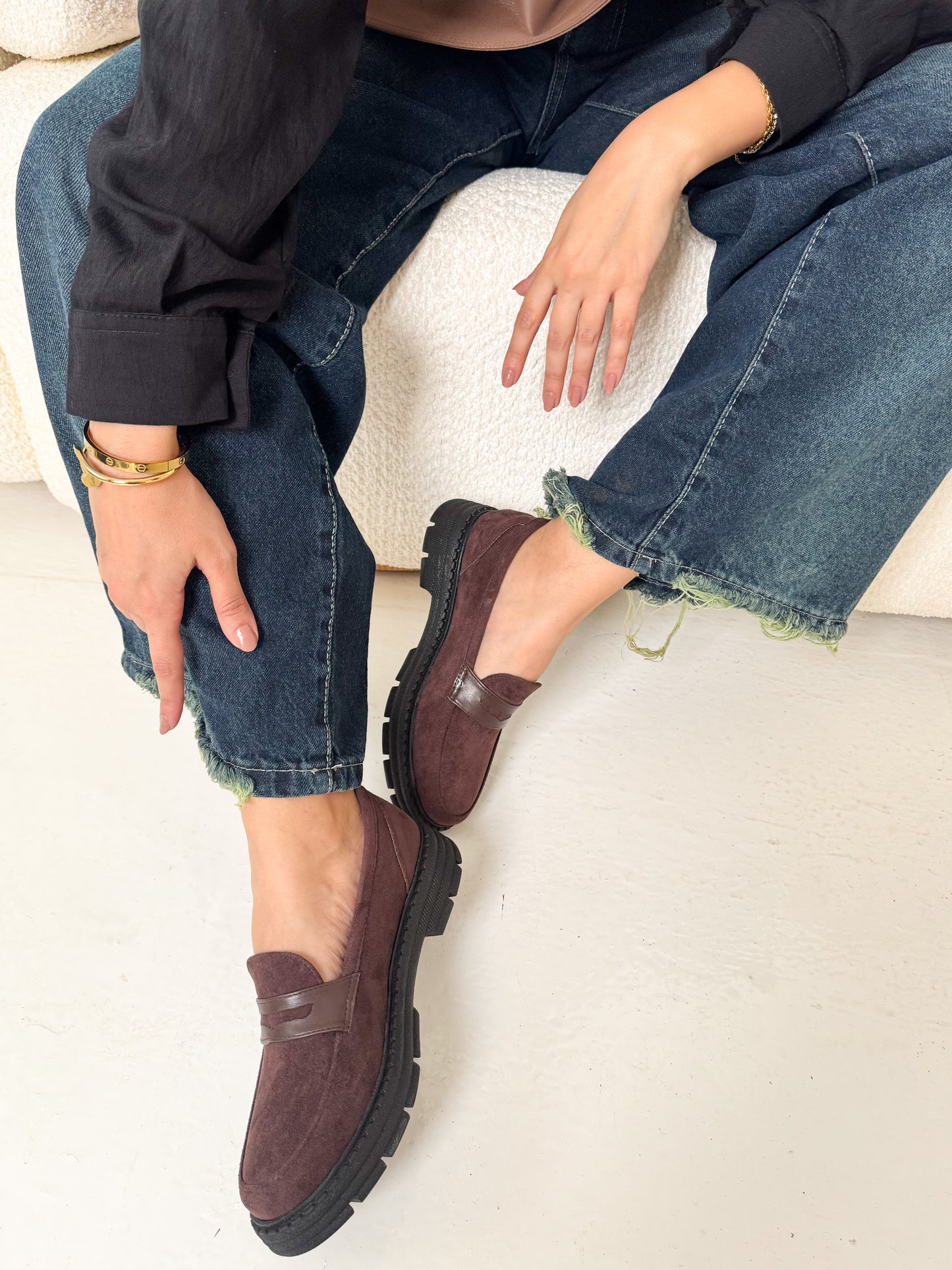 Person wearing brown loafers 