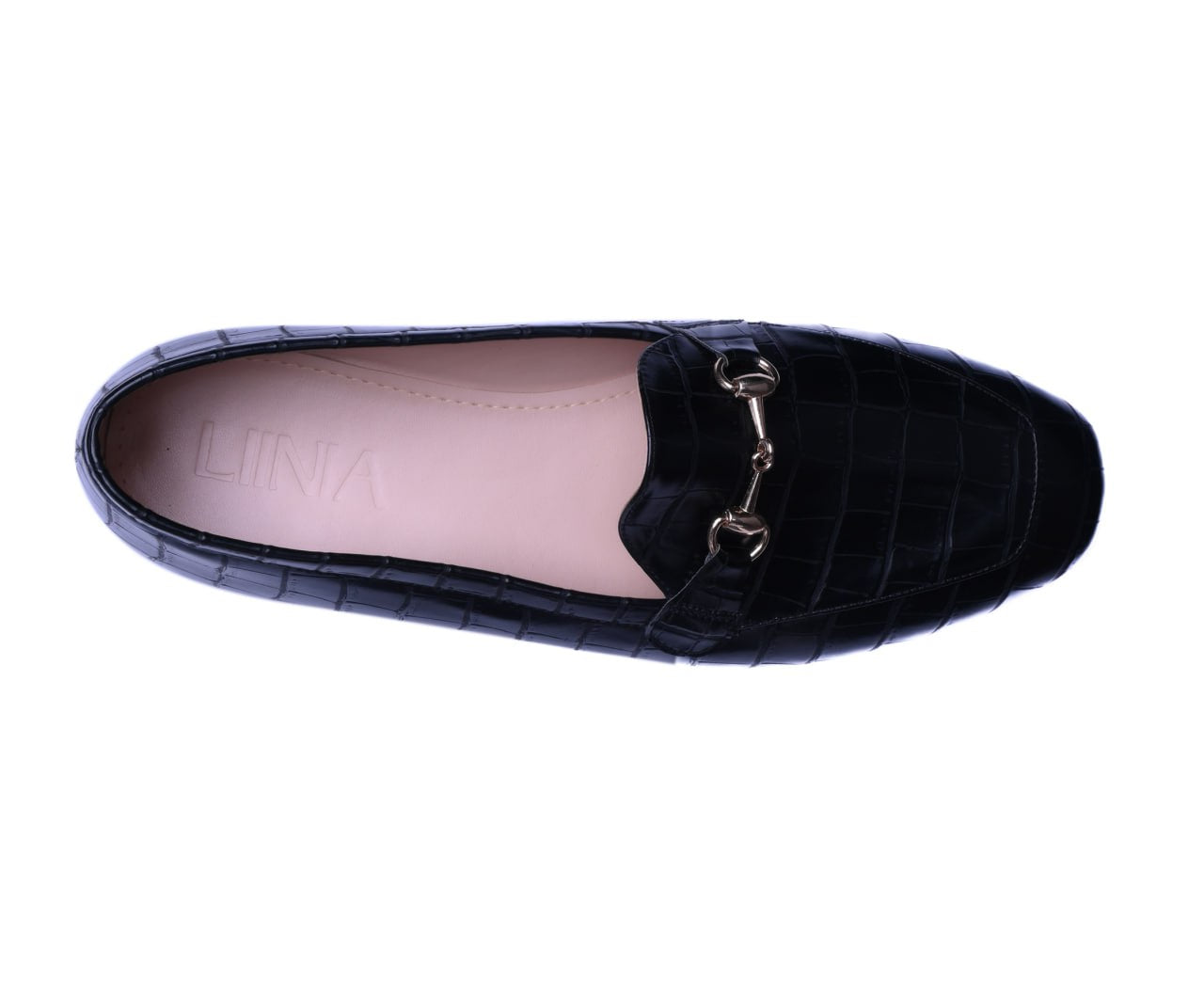 Black loafer shoe with a gold buckle on a white background