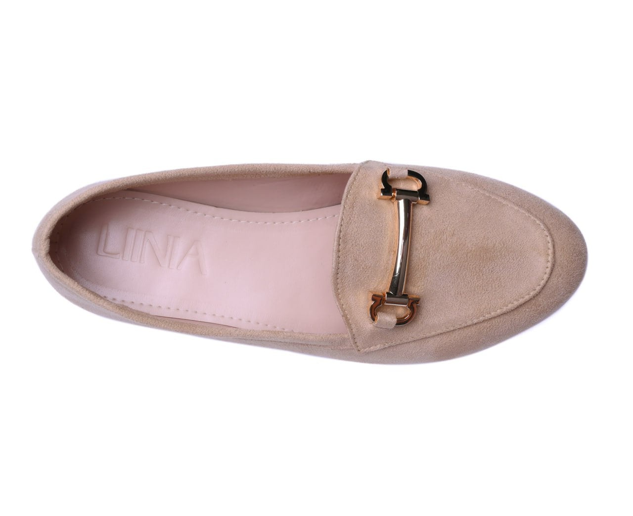 A pair of beige suede loafers with a shiny gold buckle for women