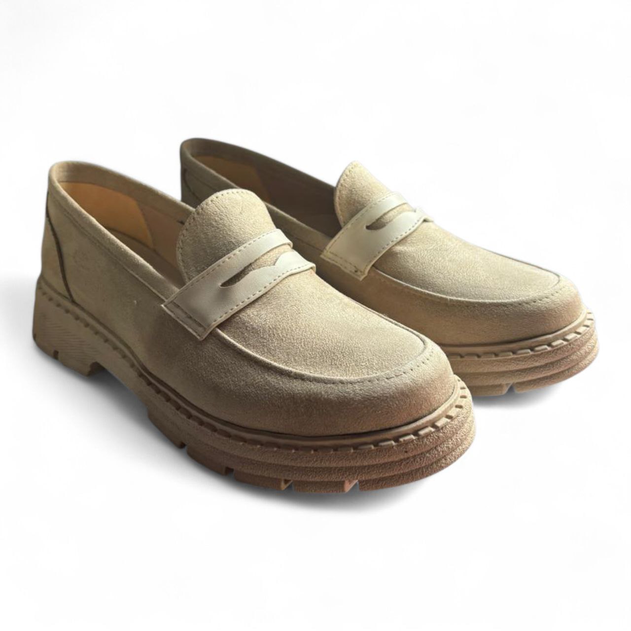 Pair of beige loafers on a white background