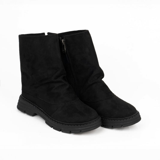 Black suede slouchy boots with a thick chunky lug sole and side zipper.